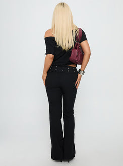 back view of model wearing Princess Polly Kortnee Eyelet Detail Flare Leg Pants Black Low Rise Pants 