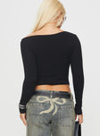 back view of model wearing Princess Polly Karre Off The Shoulder Long Sleeve Top Black Full Sleeves Asymmetric Neckline 