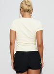 back view of model wearing Princess Polly Marseille Manners Graphic Top Cream Short Sleeves High Neck 