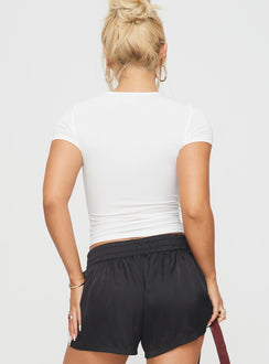 back view of model wearing Princess Polly Sugary Top White Short Sleeves Crew Neck 