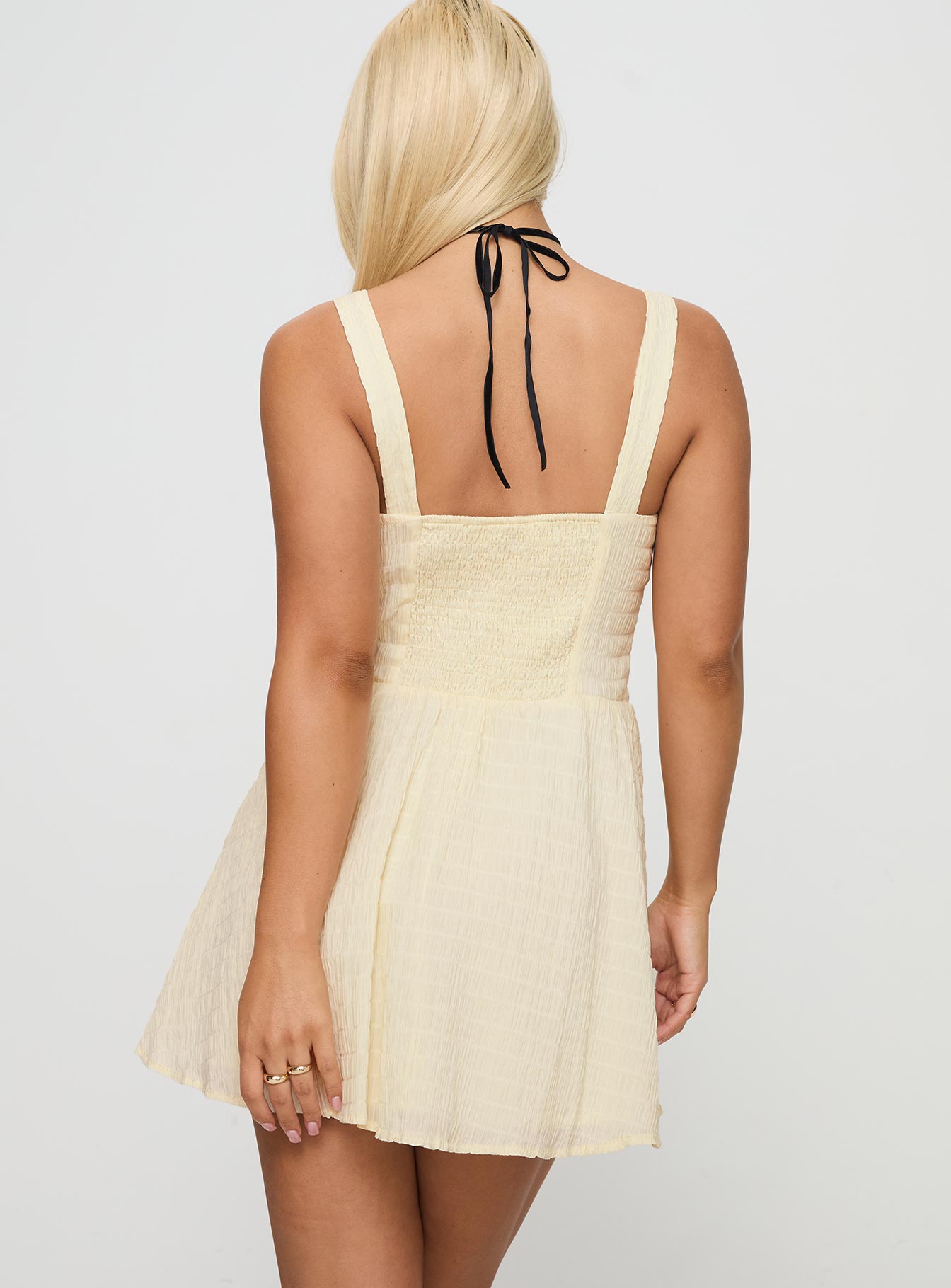back view of model wearing Princess Polly Guinevere Shirred Mini Dress Light Yellow Square Neck 