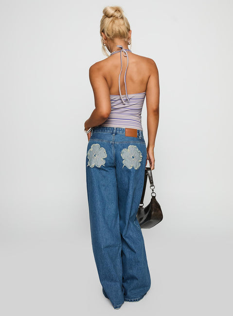 back view of model wearing Princess Polly A Keeper Flower Patch Jeans Mid Blue Low Rise Jeans 