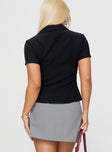 back view of model wearing Princess Polly Arnica Top Black Stripe Short Sleeves V-Neck 