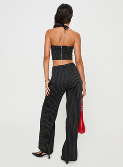 back view of model wearing Princess Polly Kimia Pants Black / White Pinstripe Mid Rise 