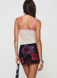 back view of model wearing Princess Polly Kennith Mini Skirt Black / Red Floral 