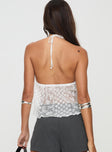 Lace top Halter neck tie fastening, tie detail at bust, split hem at front, sheer bodice Lined bust, good stretch