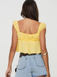 back view of model wearing Princess Polly Contardo Short Sleeve Top Yellow Short Sleeves Plunger 