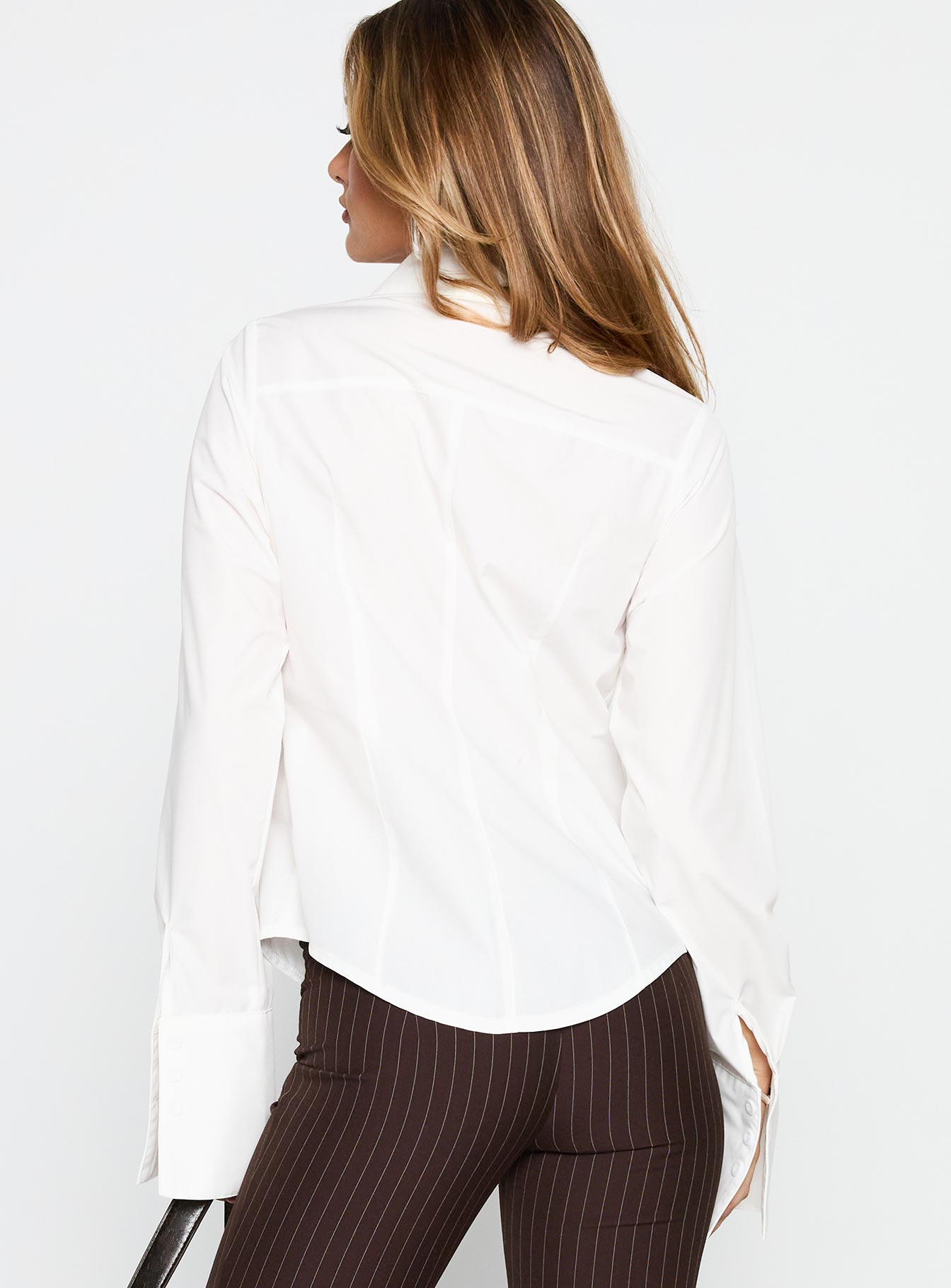 back view of model wearing Princess Polly The Temptation Long Sleeve Top White Full Sleeves High Neck 
