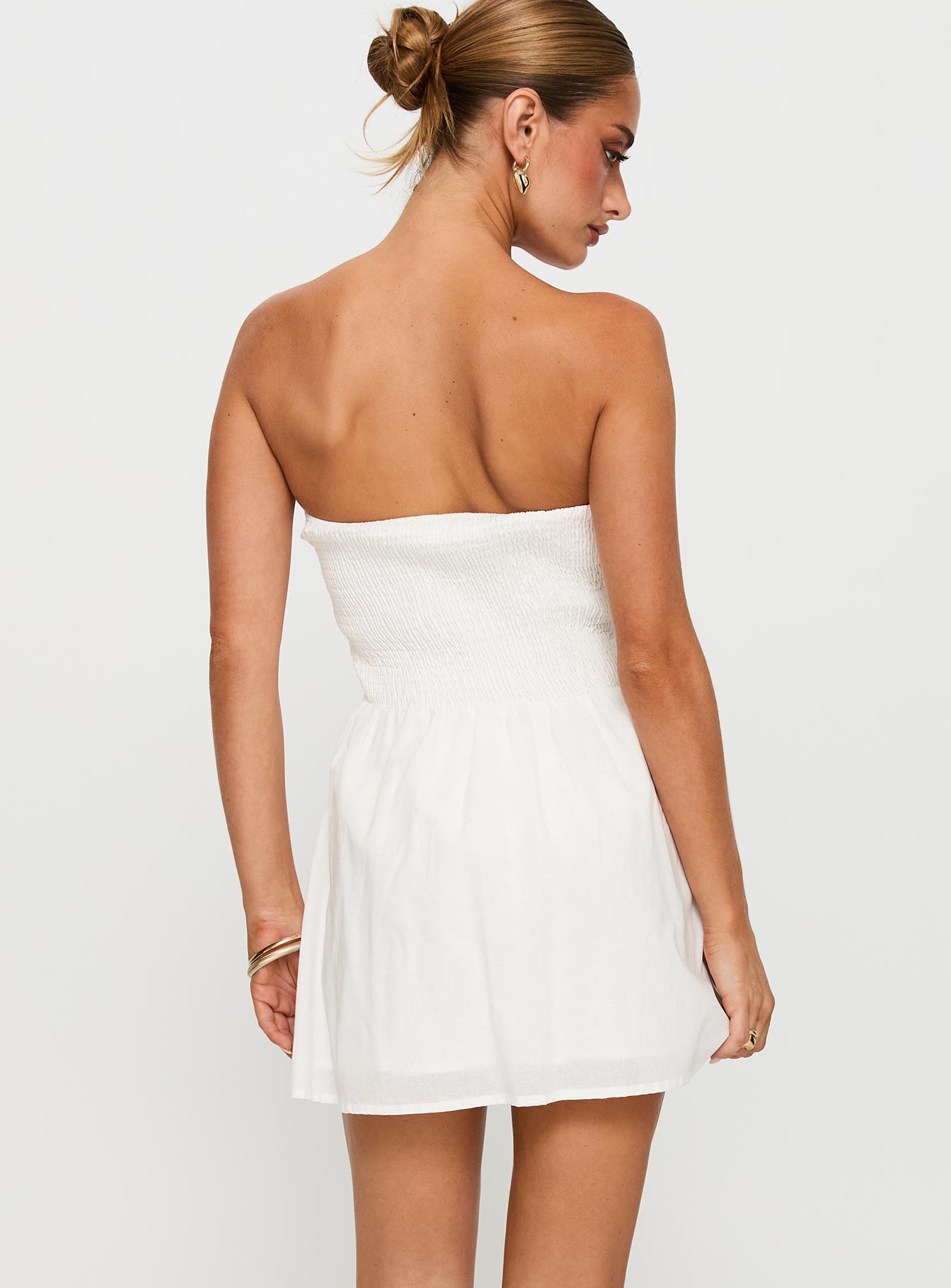 back view of model wearing Princess Polly Sybille Strapless Mini Dress White Sweetheart Neckline 