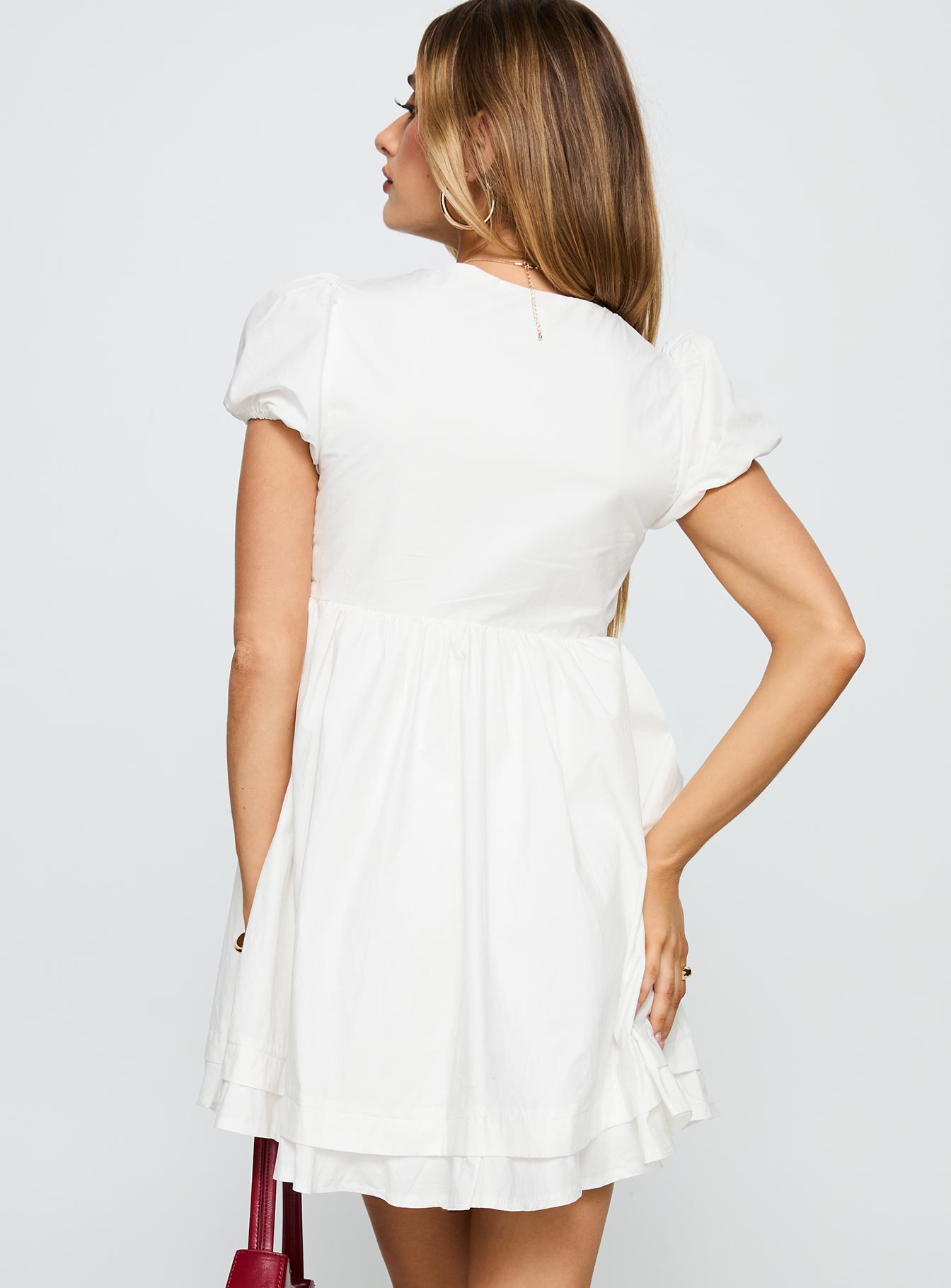 back view of model wearing Princess Polly Sailoh Puff Sleeve Baby Doll Mini Dress White V-Neck 