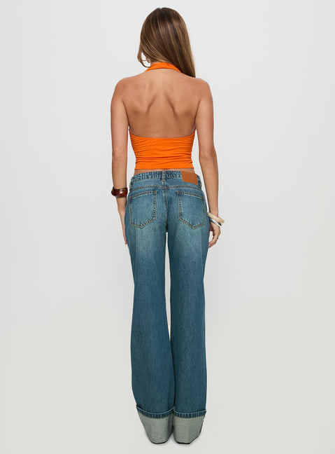 back view of model wearing Princess Polly Toros Mid Rise Wide Leg Foldover Denim Jeans Mid Blue Low Rise Jeans 