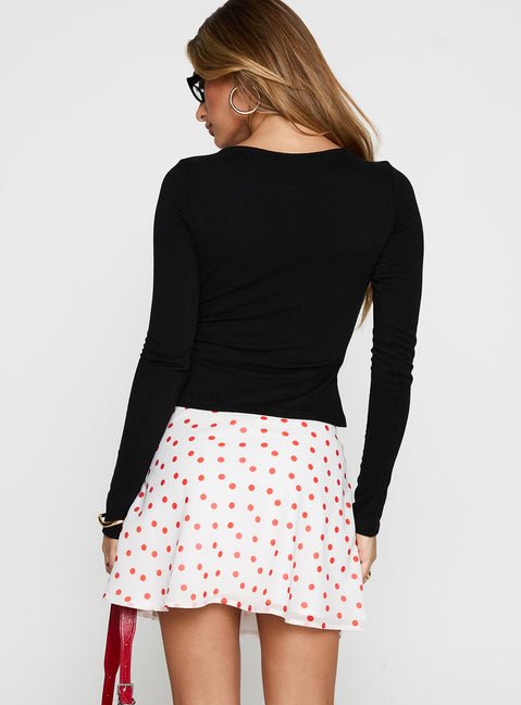 back view of model wearing Princess Polly Dapple Bias Mini Skirt White / Red Polka Mini Skirts 