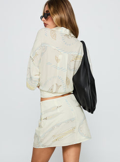 back view of model wearing Princess Polly Caraliia Mini Skirt Cream Mini Skirts 