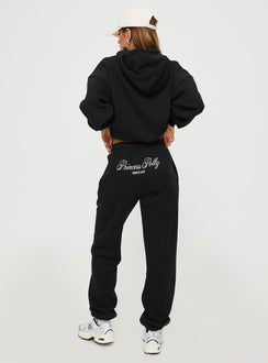 back view of model wearing Princess Polly Princess Polly Track Pants Script Black / Ivory High Waisted Pants 