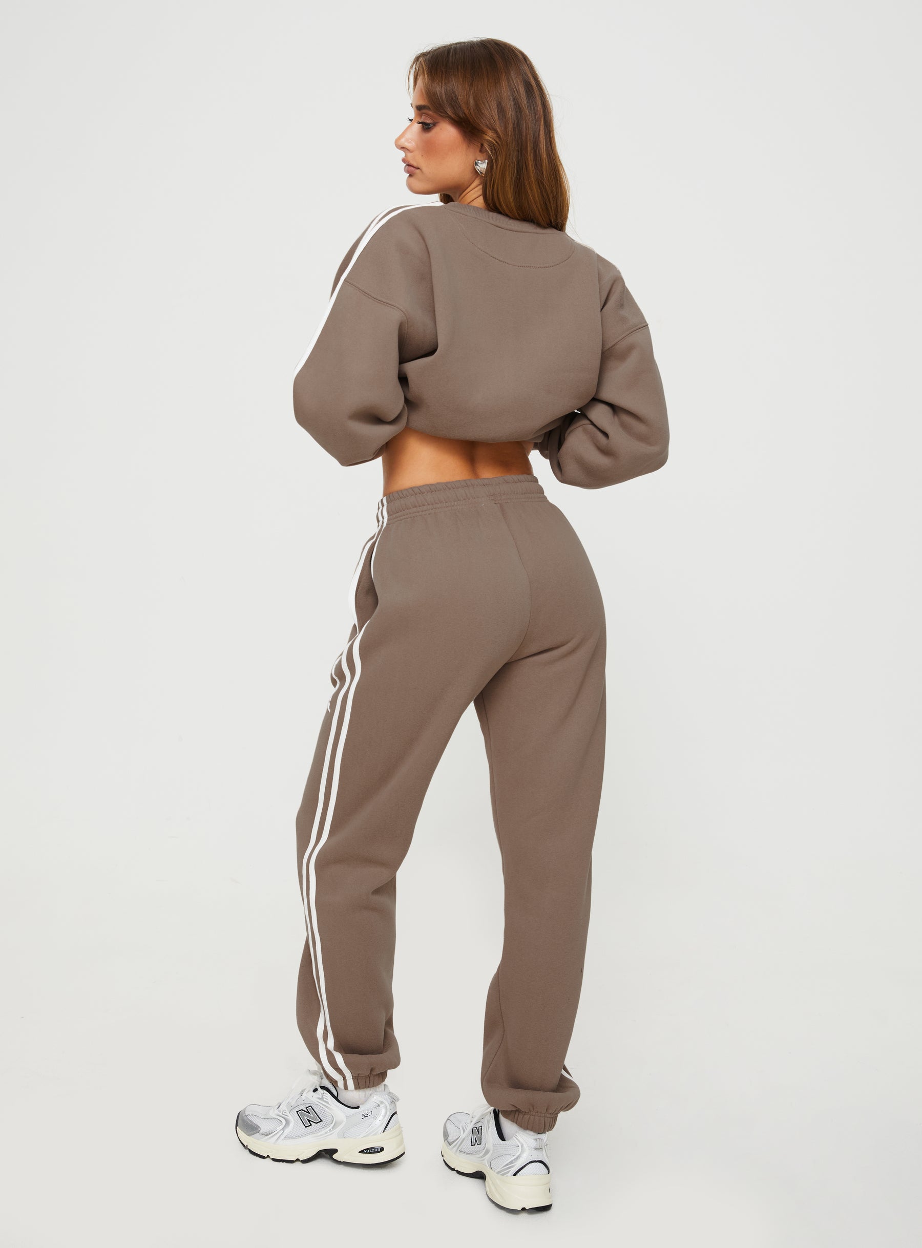 front view of model wearing Princess Polly Princess Polly Track Pants Stripe Taupe / White High Waisted Pants 