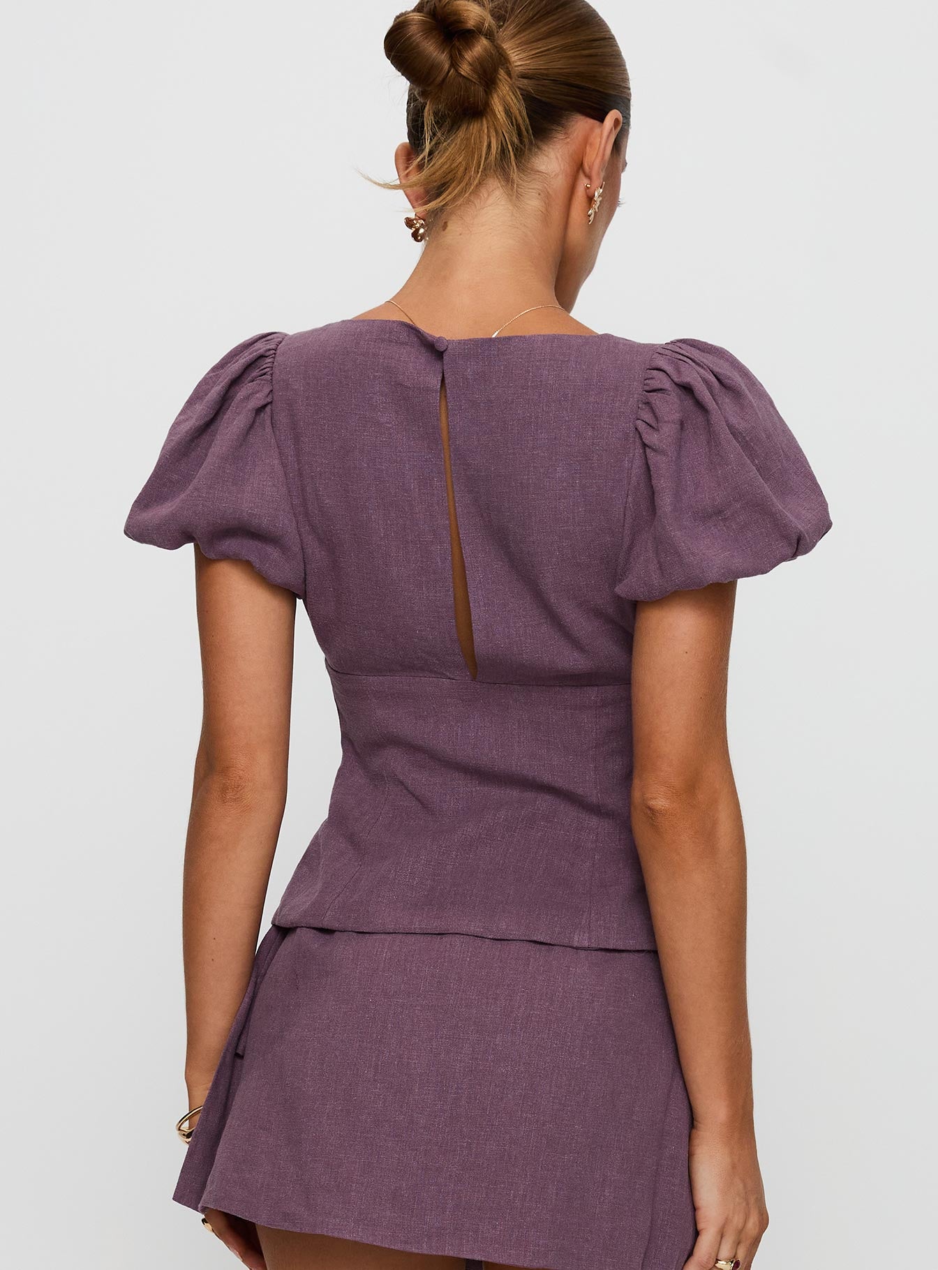 back view of model wearing Princess Polly Wilhelmina Blouse Top Mauve Short Sleeves Plunger 