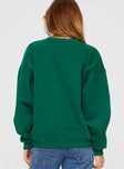 back view of model wearing Princess Polly Apres Ski Crew Neck Sweatshirt Green / Cream 