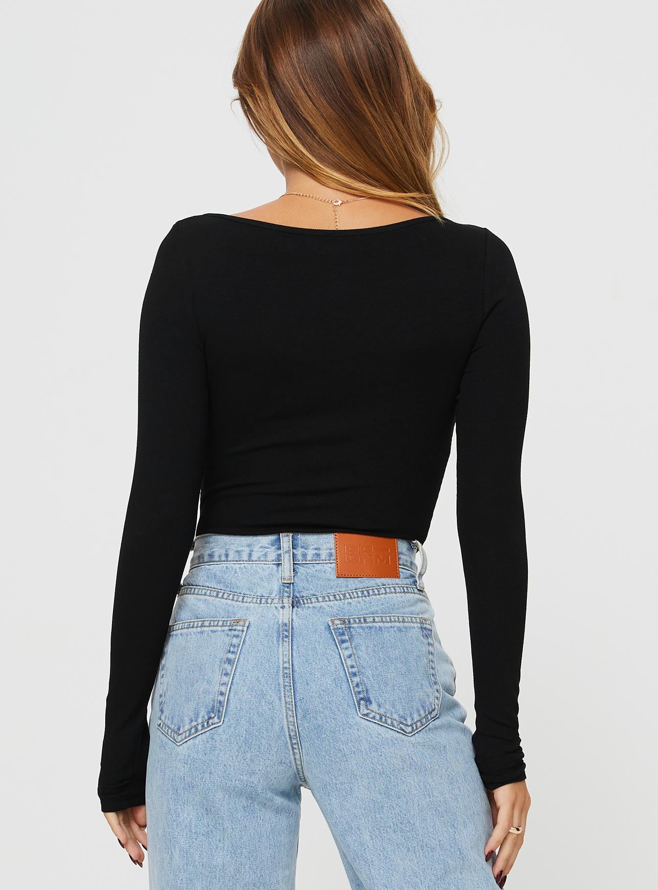 back view of model wearing Princess Polly Ballard Long Sleeve Bodysuit Black Full Sleeves Square Neck 