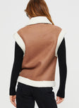 Shearling vest  Classic collar, twin hip pockets, shearling detail at shoulder and hem, faux leather detail and strap fastening at neck, silver-toned hardware, zip fastening at front 