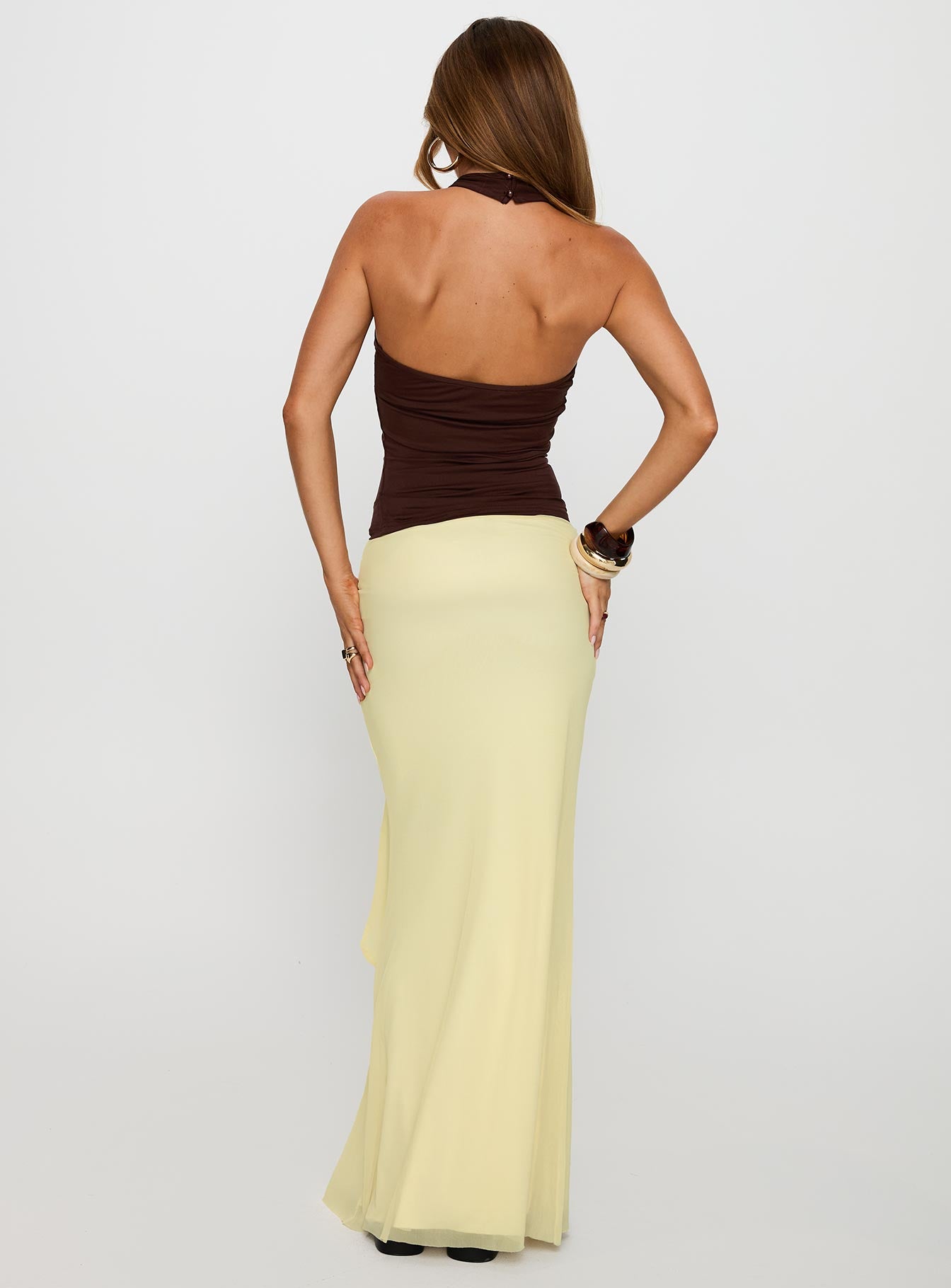 back view of model wearing Princess Polly Caviar Tie Maxi Skirt Lemon 