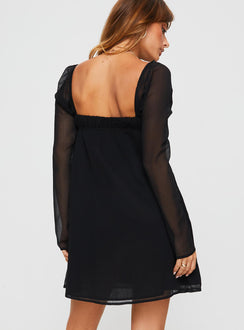 back view of model wearing Princess Polly Mooney Long Sleeve Mini Dress Black Square Neck 