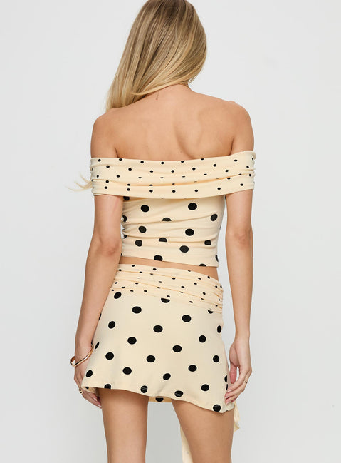 back view of model wearing Princess Polly Porzia Wrap Detail Mini Skirt Cream / Polka Dot Mini Skirts 