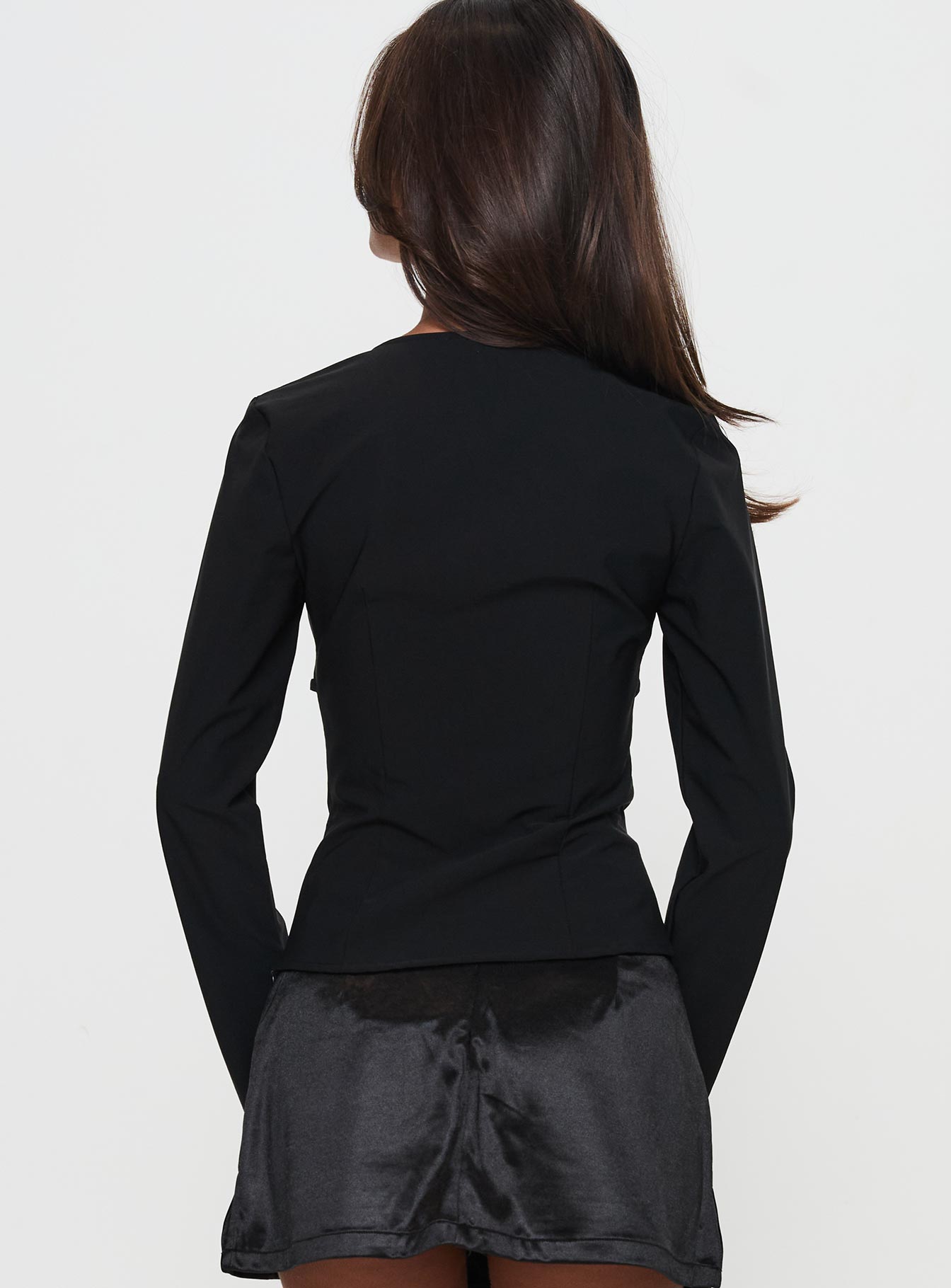 back view of model wearing Princess Polly Flounce Long Sleeve Top Black Full Sleeves Square Neck 