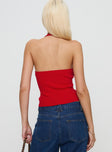 back view of model wearing Princess Polly Kingley Halter Top Red Sleeveless Plunger 