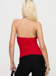 back view of model wearing Princess Polly Dafina Halter Top Red Sleeveless Cowl 