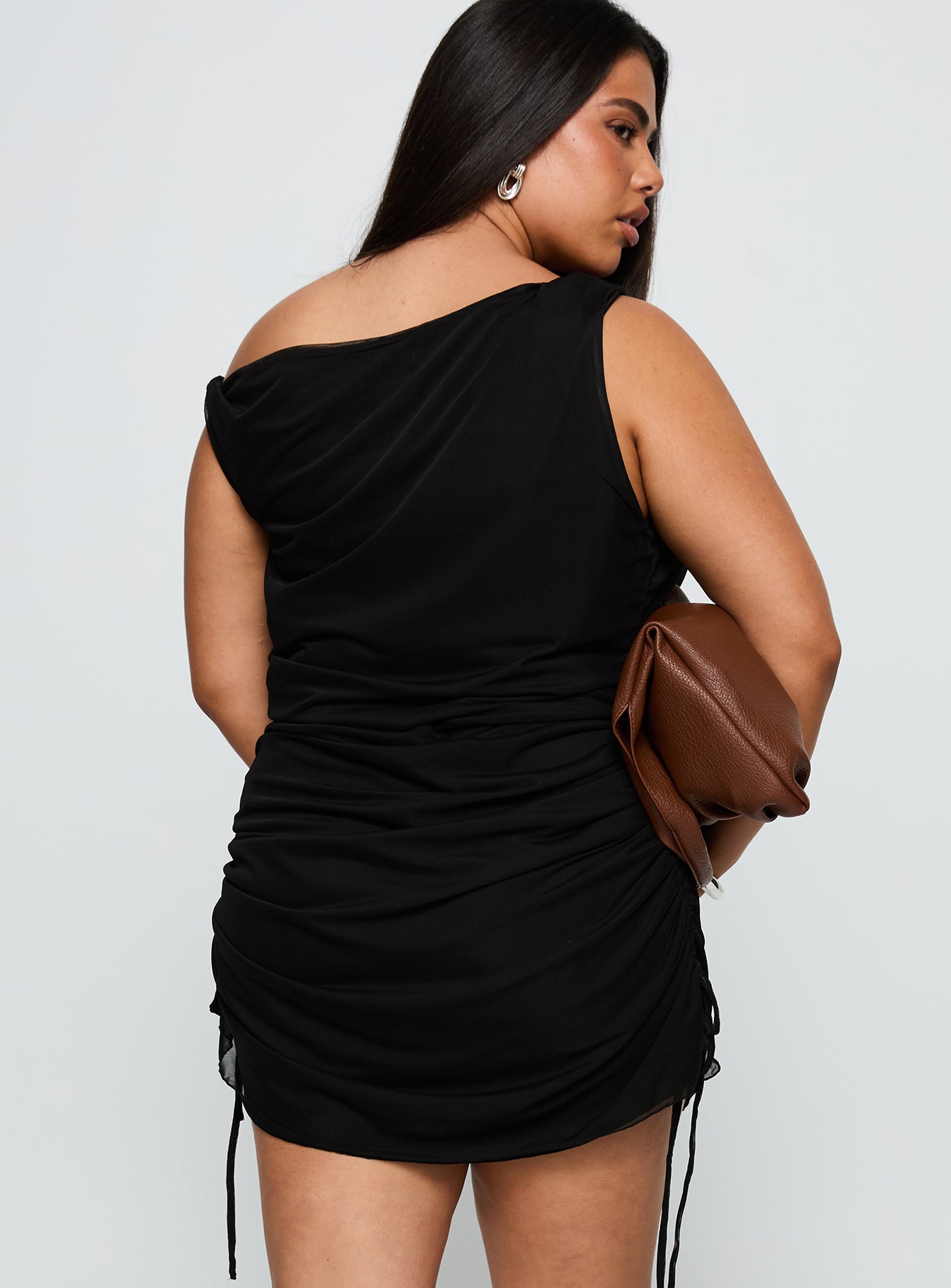 back view of model wearing Princess Polly Bella Luna Ruched Mini Dress Black Curve Asymmetric Neckline 