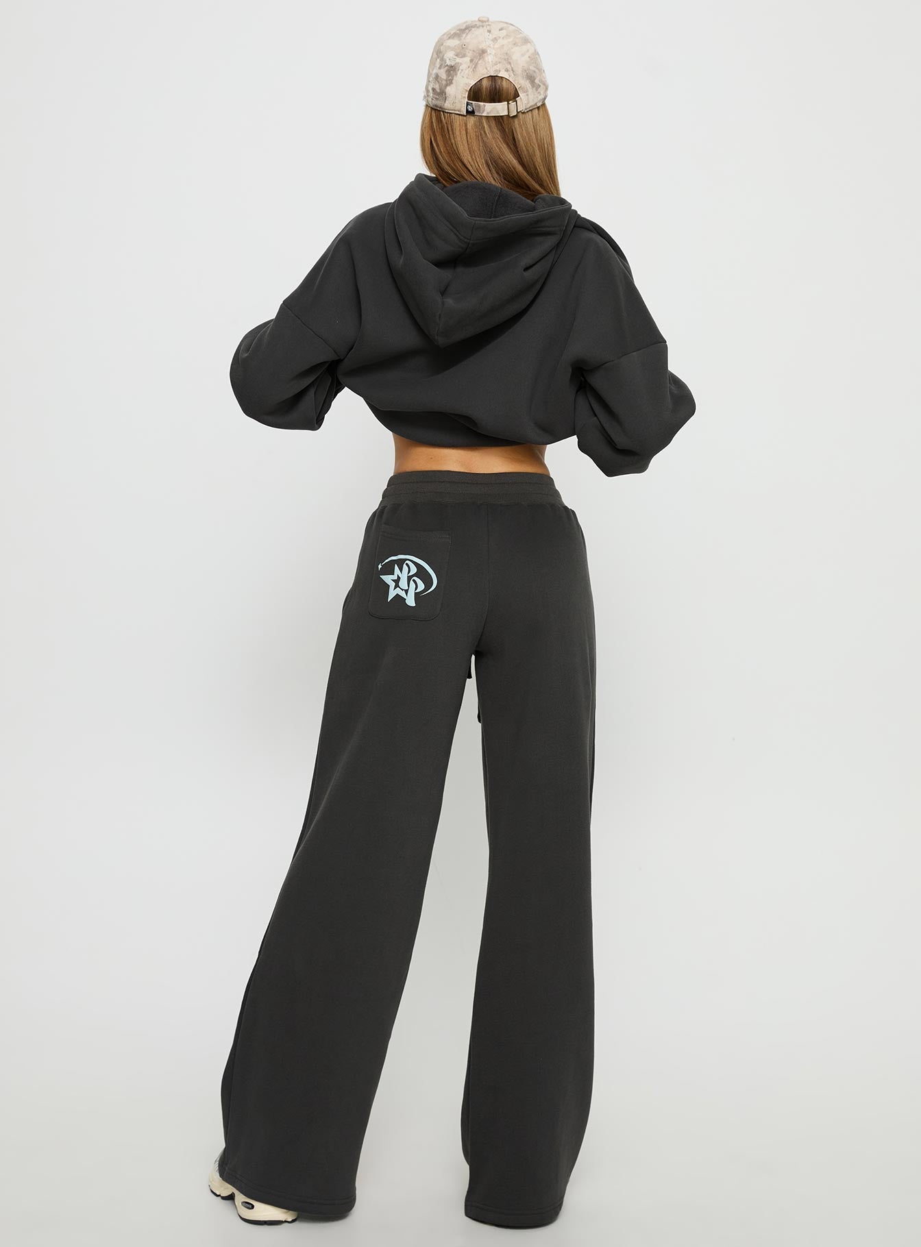 back view of model wearing Princess Polly Princess Polly Stargirl Wide Leg Sweat Pants Charcoal High Rise Pants 