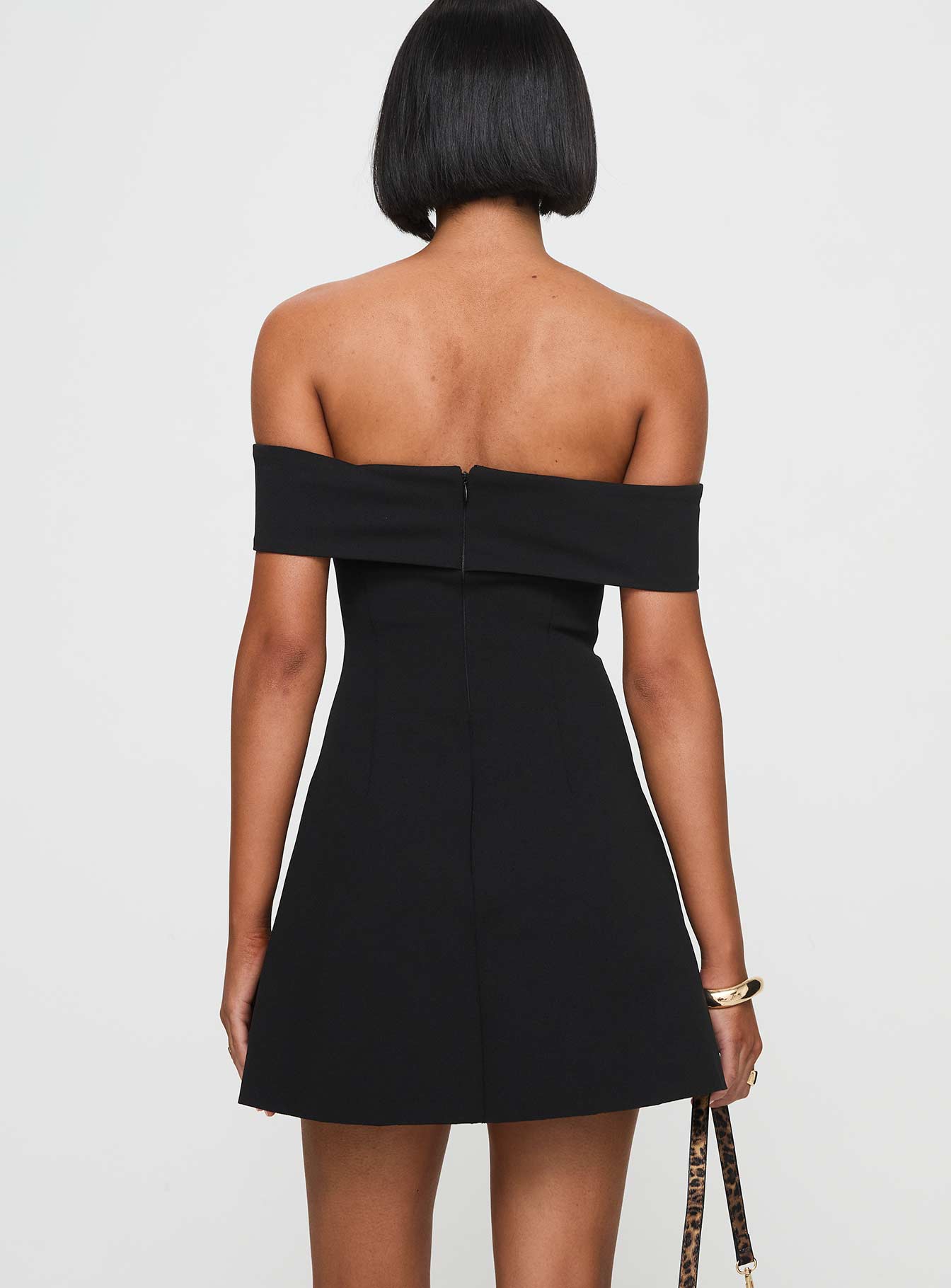 back view of model wearing Princess Polly Lanes Off The Shoulder Mini Dress Black Tall Sweetheart Neckline 