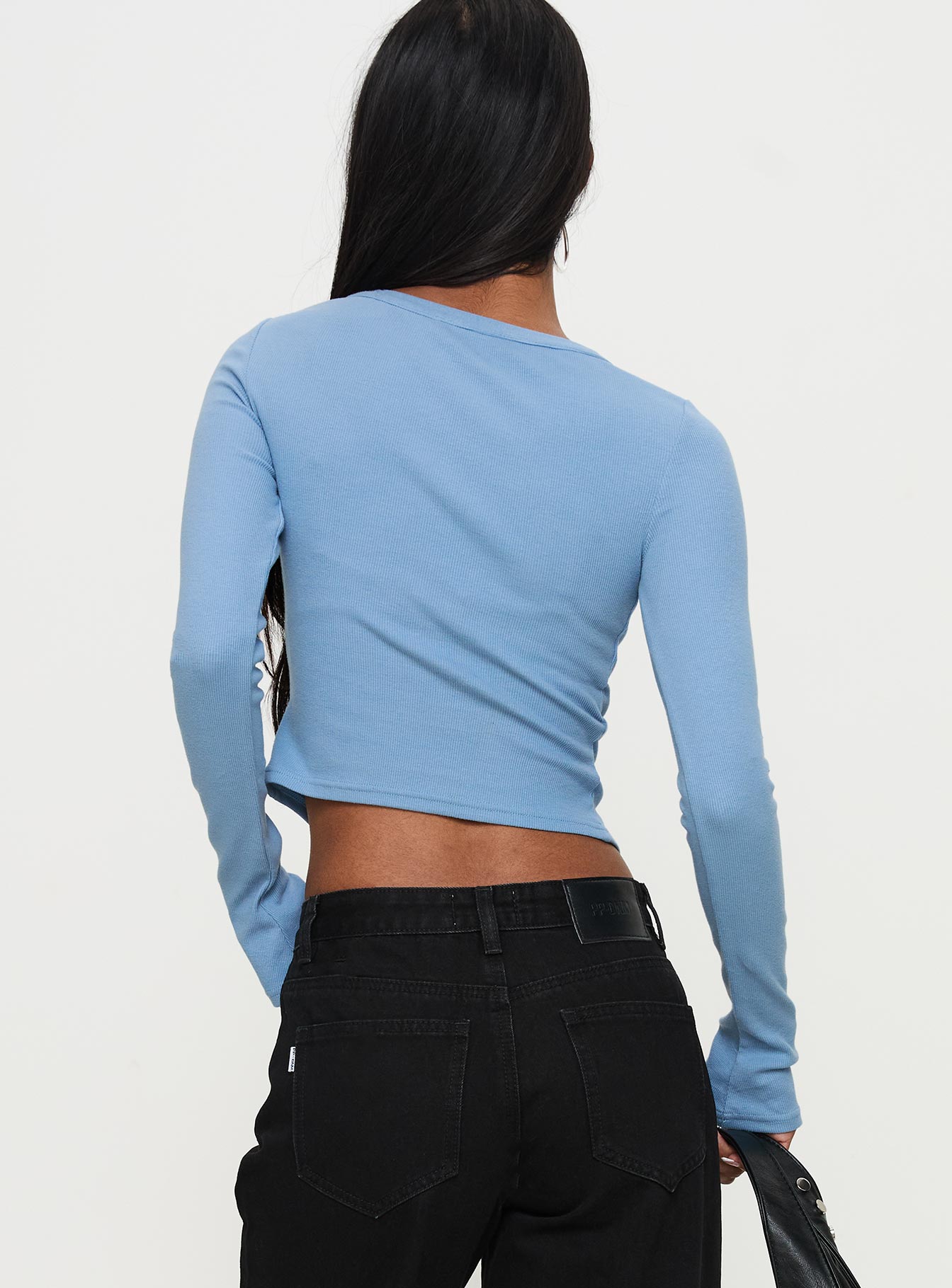 back view of model wearing Princess Polly Baseline Rib Long Sleeve Top Blue Full Sleeves Crew Neck 