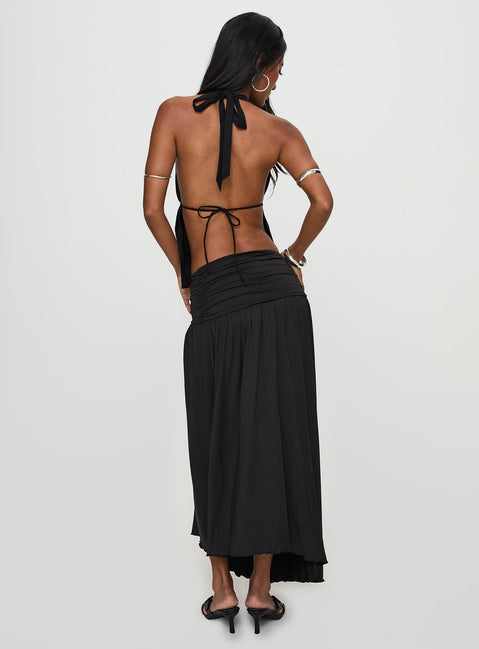 back view of model wearing Princess Polly Gezabele Asymmetrical Maxi Skirt Black Maxi 