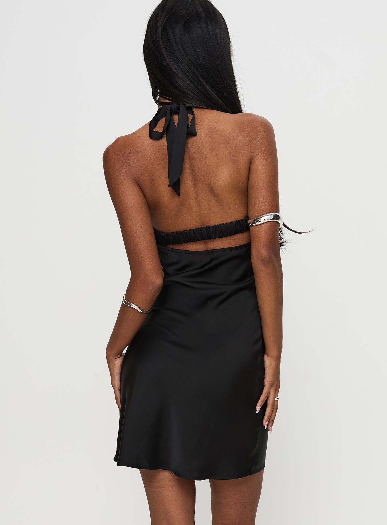 back view of model wearing Princess Polly Tempeste Halter Mini Dress Black Cowl Neck 