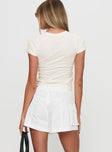 back view of model wearing Princess Polly Colonel Cargo Mini Short White High Waisted Shorts 