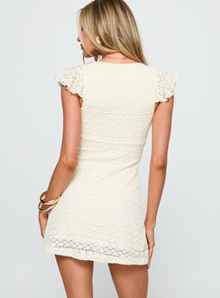 back view of model wearing Princess Polly Flying Overhead Mini Dress Cream Plunger 