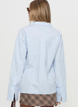 back view of model wearing Princess Polly Calistoga Deep Collar Shirt Blue Full Sleeves V-Neck 