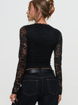 back view of model wearing Princess Polly Temptation Incoming Long Sleeve Lace Top Black Full Sleeves V-Neck 