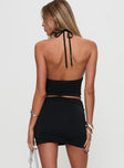 back view of model wearing Princess Polly Imorie Ruched Mini Skirt Black Mini Skirts 