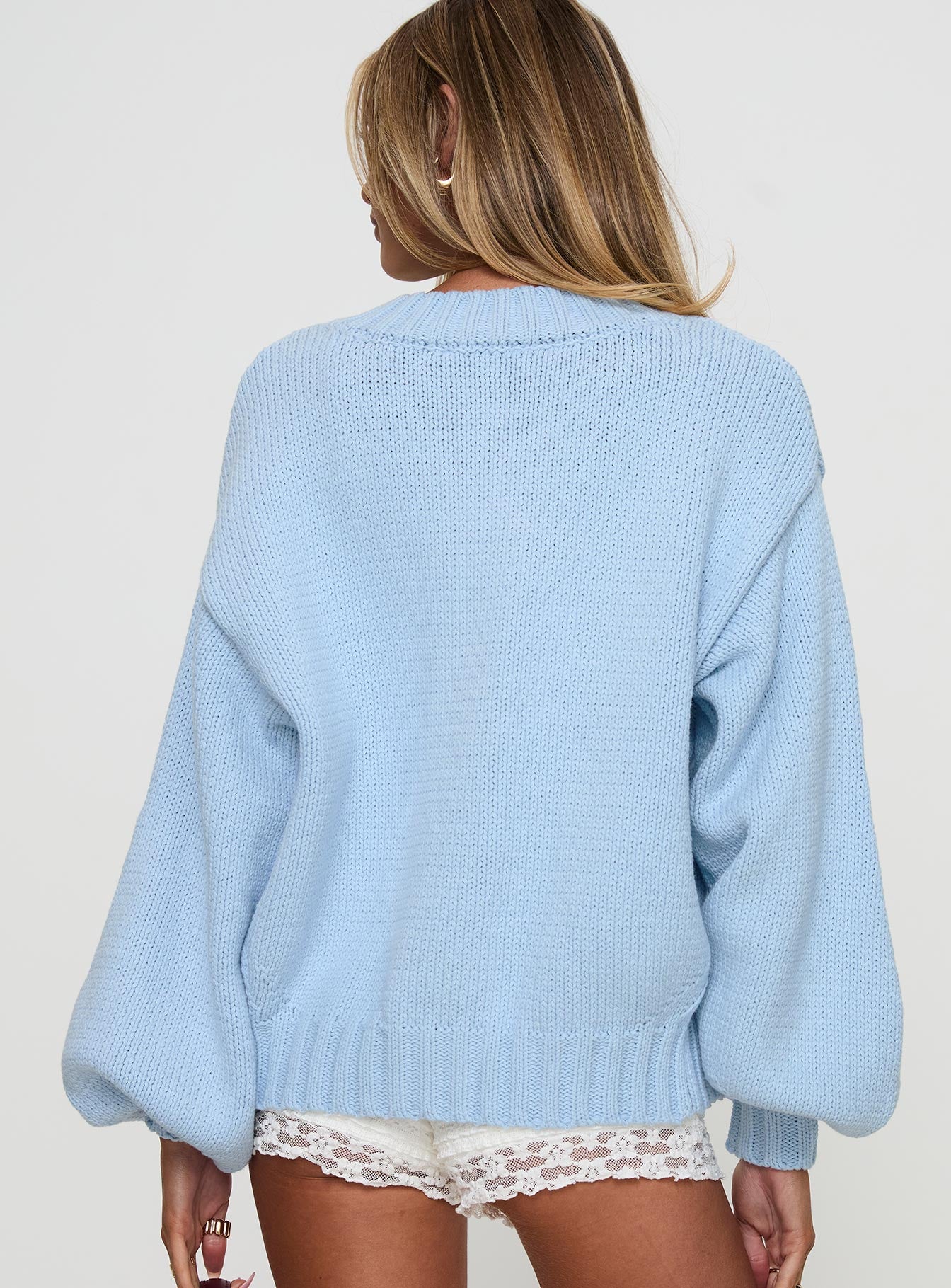 back view of model wearing Princess Polly Edern Cardigan Blue cropped 