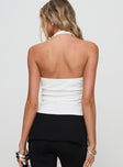 back view of model wearing Princess Polly Fontanne Twist Top White Sleeveless Plunger 