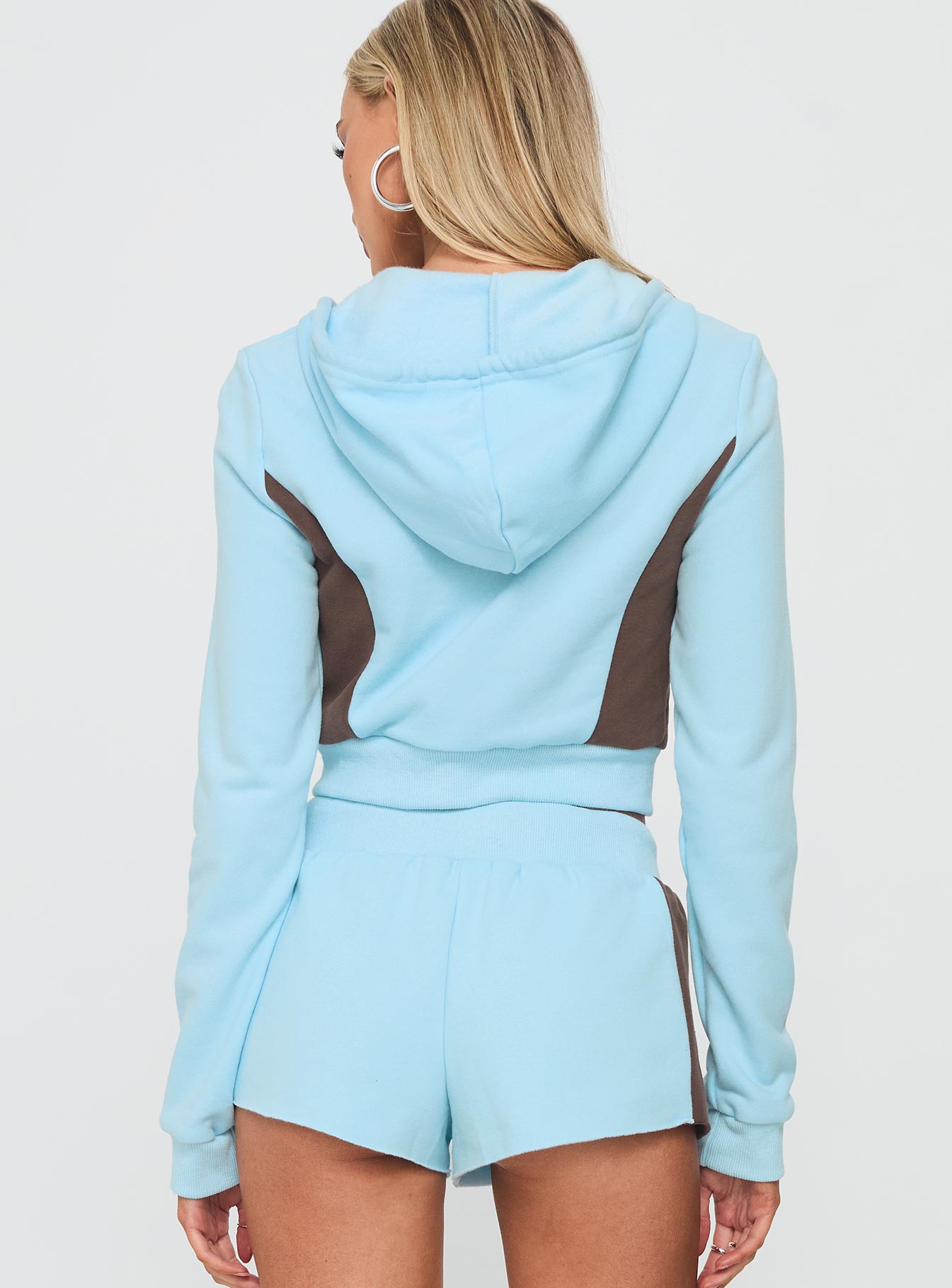 back view of model wearing Princess Polly Notable Double Zipper Jumper Blue cropped 