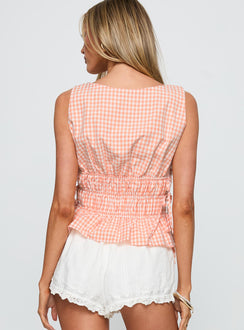 back view of model wearing Princess Polly Antiqued Tie Side Top Orange Check Sleeveless Boat Neck 