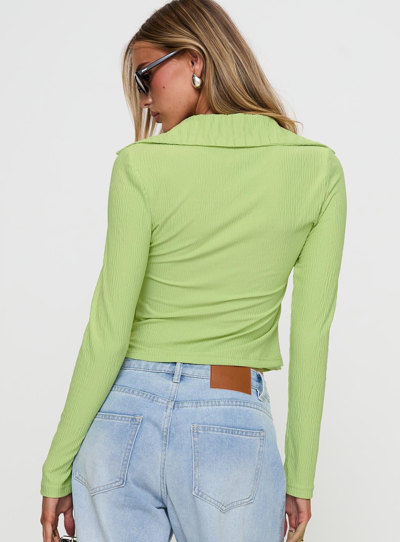 back view of model wearing Princess Polly Echoes Long Sleeve Top Green Full Sleeves V-Neck 