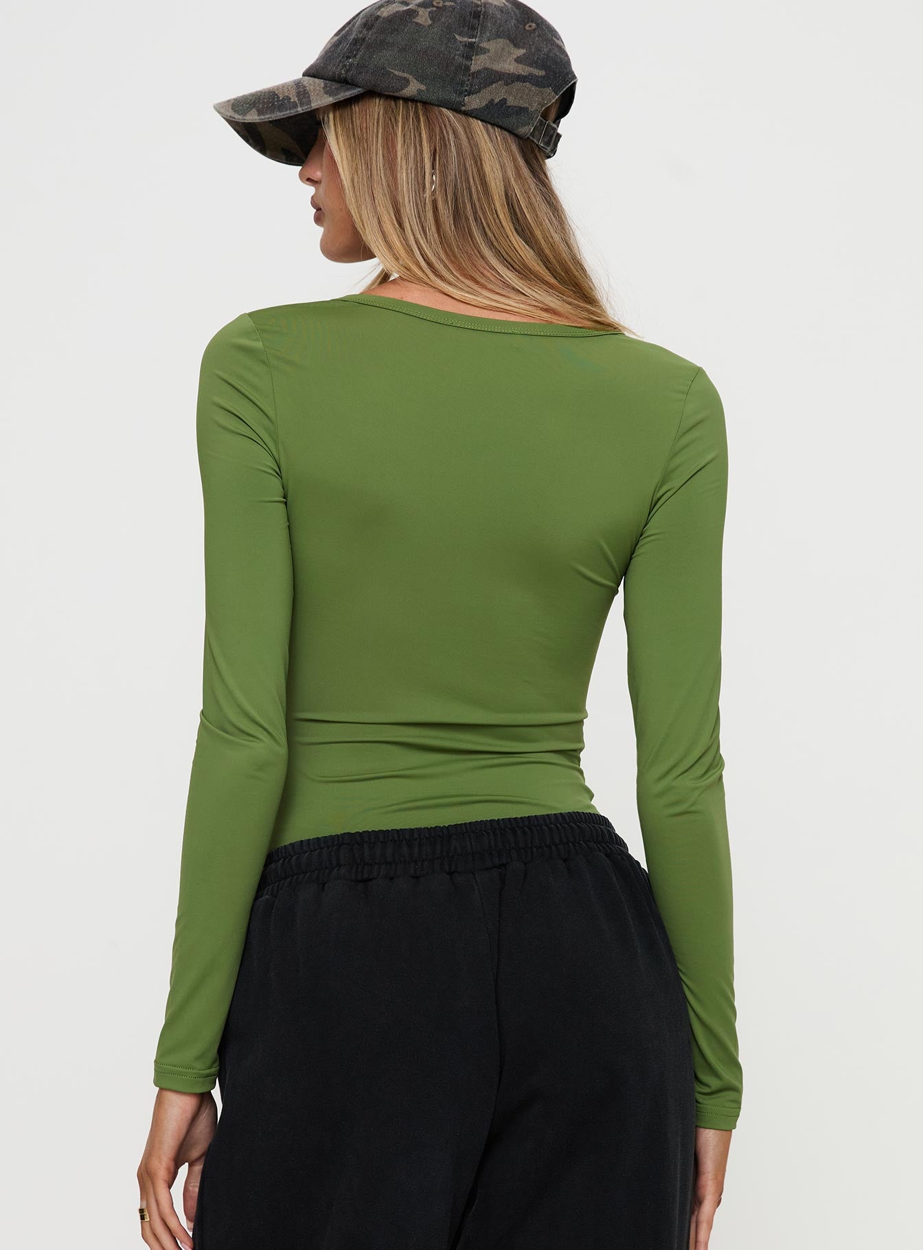 back view of model wearing Princess Polly Delgado Long Sleeve Bodysuit Olive Full Sleeves 