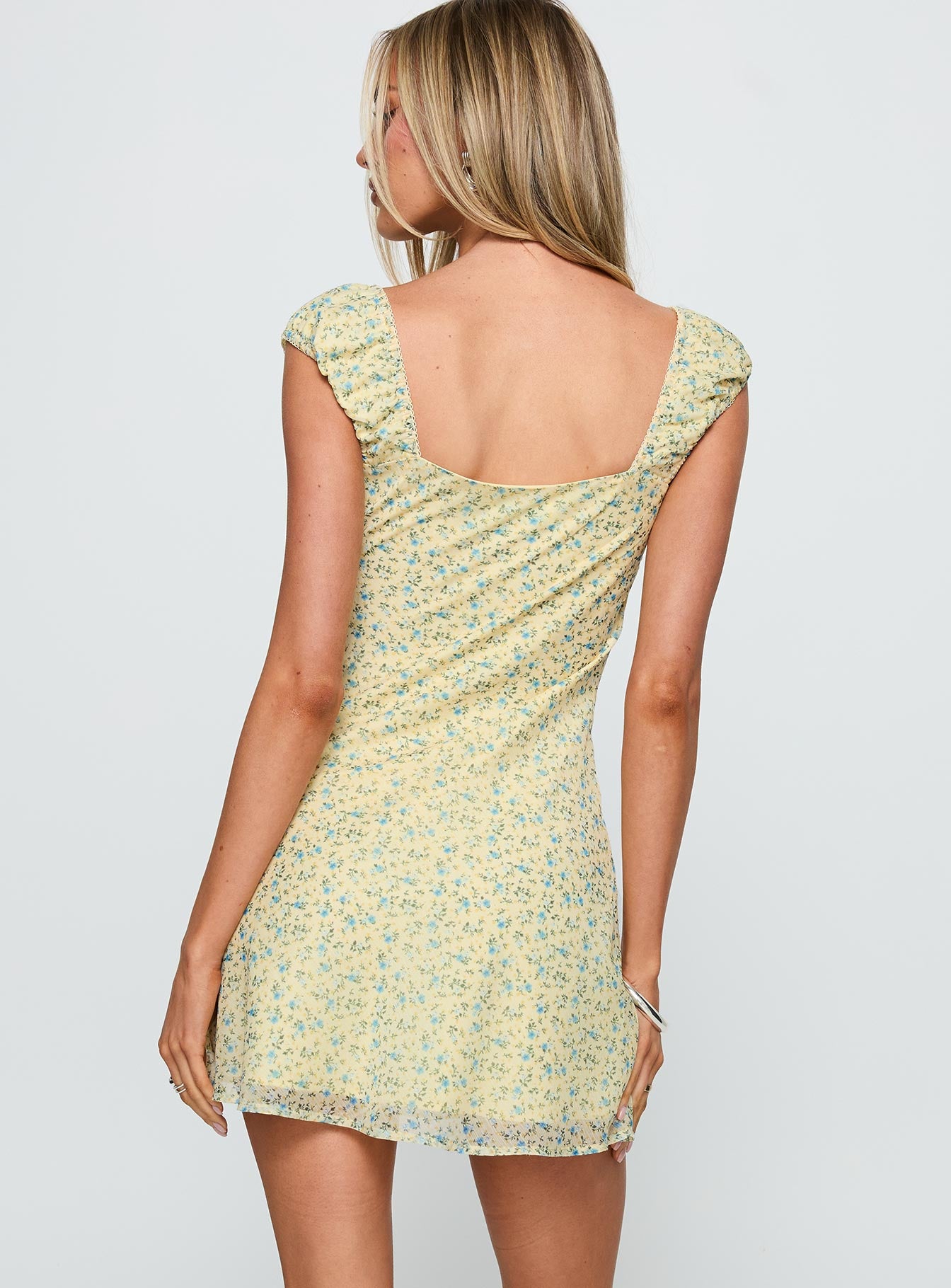 back view of model wearing Princess Polly Seyani Mini Dress Yellow Sweetheart Neckline 