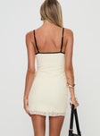 back view of model wearing Princess Polly Nolane Mini Dress Cream Tall V-Neck 