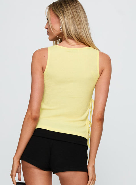back view of model wearing Princess Polly Dignity Tie Side Top Yellow Sleeveless Crew Neck 