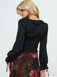 back view of model wearing Princess Polly Evadne Long Sleeve Top Black Full Sleeves Plunger 